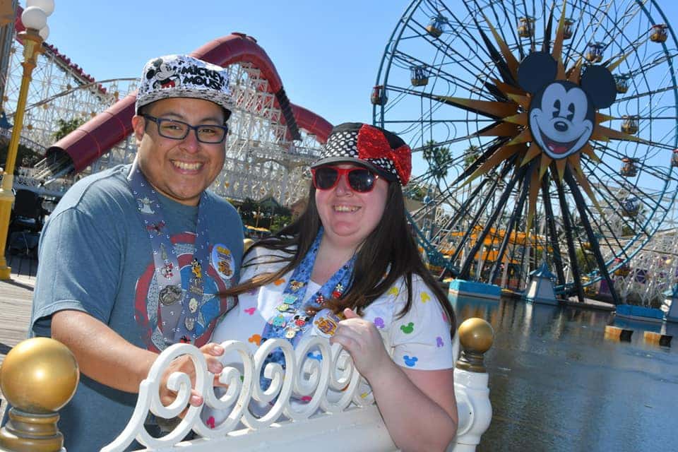 Michael Apostol, Community Manager, and his wife at Disney theme park